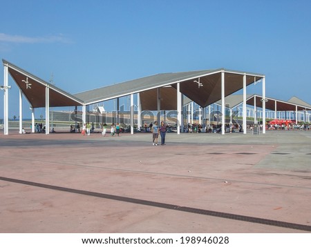 BARCELONA, SPAIN - AUGUST 01, 2010: Tourists visiting the new modern architecture in the Diagonal Mar area on the seaside