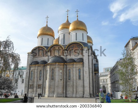 MOSCOW, RUSSIA - OCTOBER 20, 2012: Tourists visiting the Cathedral of the Dormition Russian Orthodox church dedicated to the Dormition of the Theotokos