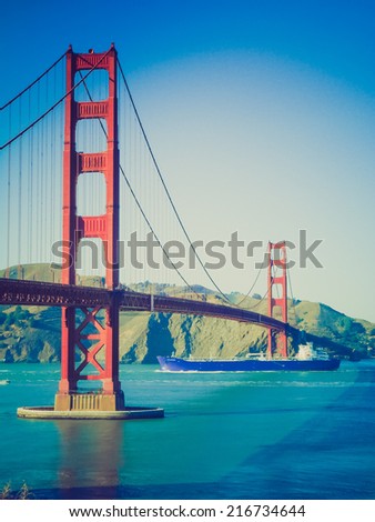 Vintage looking The Golden Gate suspension bridge spanning the Golden Gate strait channel between San Francisco Bay and the Pacific Ocean