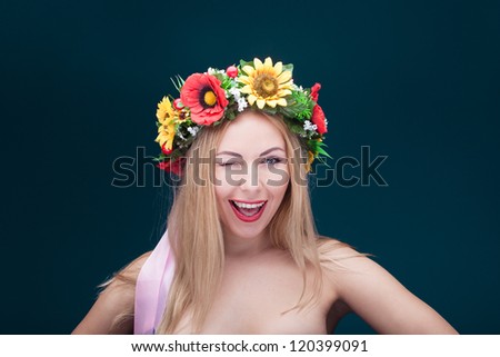 portrait of beautiful smiling woman with wreath on her head