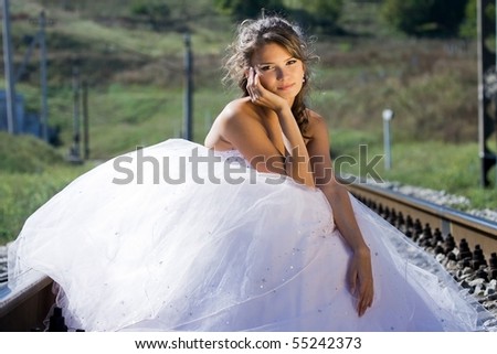 portrait of young beautiful bride in summer outdoor