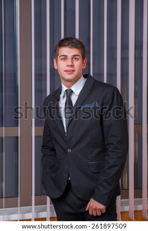 Shot of an elegant young man wearing suit