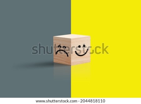 Sad happy concept. smiley face and sad face icon on wood cube, Service rating, satisfaction concept, and Optimism pessimism concepts. 3d Wooden Cub. Bright yellow and dark background. 3D illustration  ストックフォト © 