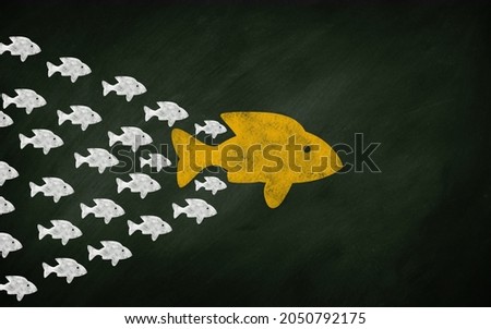 Leadership Fish Concept Blackboard. big fish Leading A Herd of small fishes on chalkboard  3d illustration  Stock fotó © 