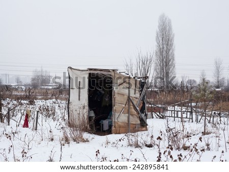 Temporary self-made shelter covered with the snow in winter.