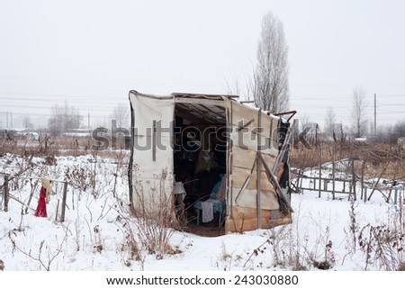 Temporary self-made shelter covered with the snow in winter.