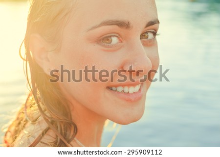 Closeup portrait of sexy pretty girl having fun relaxing in the water on summer outdoors copy space background