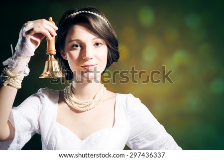 Cool pretty young woman with ring bell