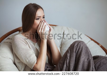 Sad young girl with tissue