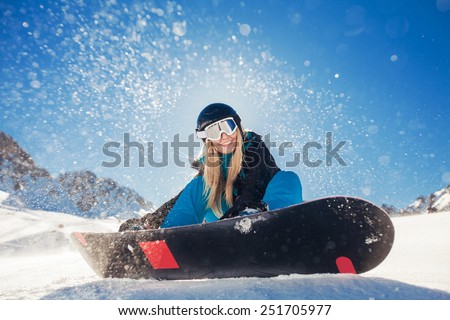 girl snowboarding in the mountains
