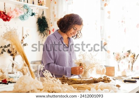 Similar – Image, Stock Photo Arranged bouquet of dried flowers and grasses in natural colours in autumn sunshine in front of a nursery in Oerlinghausen near Bielefeld in the Teutoburg Forest in East Westphalia-Lippe