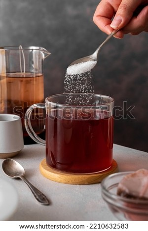 Similar – Image, Stock Photo Person pouring sugar powder with tea strainer above cake