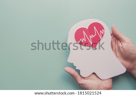 Hands holding paper brain and heart, brain stroke, world heart day, world mental health day, Alzheimer and wellness concept