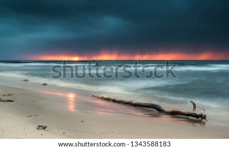 Photo of Baltic Sea in the village of Wicie - Poland. It presents the movement of waves and the sunset sun Zdjęcia stock © 