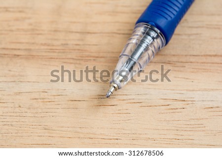 pen on wood