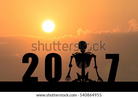 Silhouette Of Skeleton Sit In 2017 Text ,Waiting For Happy New Year Concept Stock Photo