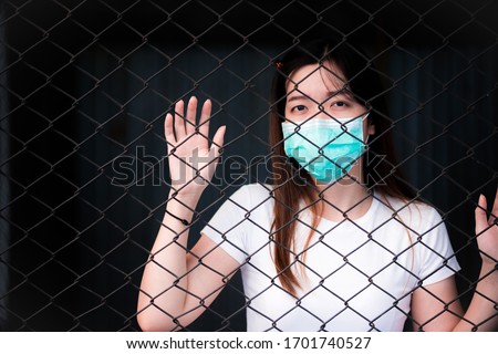 Similar – Image, Stock Photo Corona Thoughts | Fenced off green area with red and white barrier grid and red and white barrier tape that flutters in the evening wind