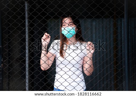 Image, Stock Photo Corona Thoughts | Fenced off green area with red and white barrier grid and red and white barrier tape that flutters in the evening wind