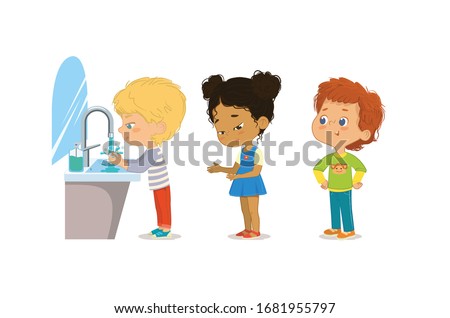 Hygiene. Children are washing their hands. Perspective of children standing at the wash basin. School girls and boys waiting to wash