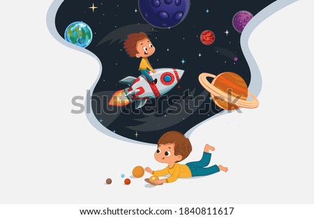 Cute preschool boy sit on the floor and play with the toy planets and imagine himself trevel on the rocket. Space, rockers stars, galaxy, and planets in the background. Kids Imagination and