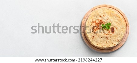 Similar – Image, Stock Photo Indian flatbreads on a blue background, above view. Homemade naan bread