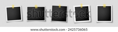 A set of five realistic photo frames with black inserts and sticky tapes. Retro photo frames with a shadow highlighted on a transparent background. Vector EPS 10.