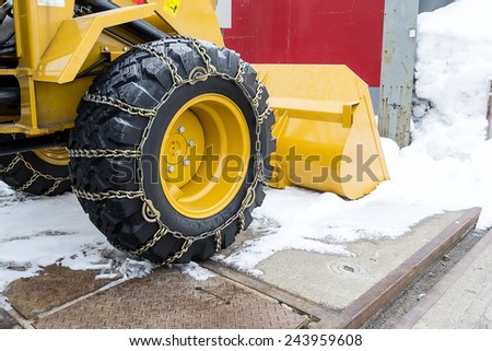 Tractor tires with chains in the snow