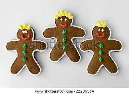 Three homemade gingerbread men cookies