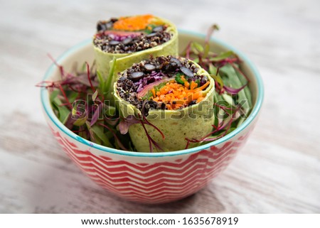 Similar – Image, Stock Photo Grilled spinach fajitas served with cottage cheese and sauce