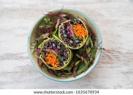 Similar – Image, Stock Photo Grilled spinach fajitas served with cottage cheese and sauce