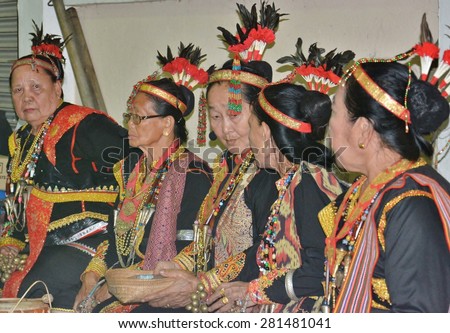 SABAH, MALAYSIA-MAY 24, 2015: A group of Dusun Lotud Shaman(Bobohizan) in traditional costumes during Harvest Festival celebration in Tamparuli, Sabah, Malaysia.