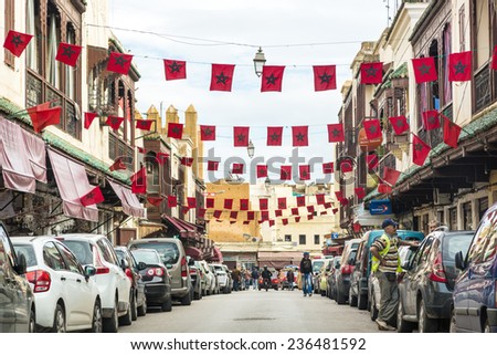 FEZ, MOROCCO - NOVEMBER 17, 2014: Lots of Morocco flags filling up the streets in downtown city of Fez, Marrocos, Africa