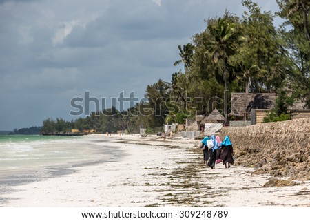 Local people in the Uroa beach in Zanzibar, Tanzania, Africa