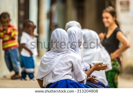 STONE TOWN ,TANZANIA - AUGUST 12 2015 ; Kids playing in the streets of Stone Town in Zanzibar, Tanzania, Africa