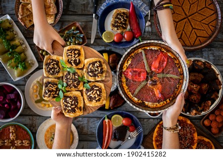 Many kinds of food and meze on the dining table. Local foods named muhammara cevizli biber and icli kofte. Traditional foods concept.  Stok fotoğraf © 