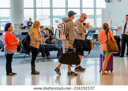 September 12, 2014: IAH, Houston Intercontinental Airport, Houston, TX, USA - Passengers queued in line for boarding at departure gate
