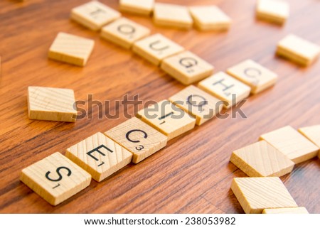 December 14, 2014 - Houston, Texas, USA - illustrative editorial of Scrabble tiles spelling TOUGH CHOICES
