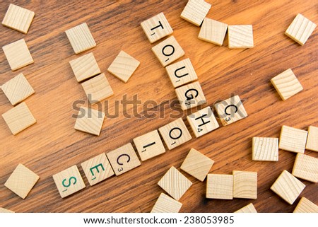 December 14, 2014 - Houston, Texas, USA - illustrative editorial of Scrabble tiles spelling TOUGH CHOICES