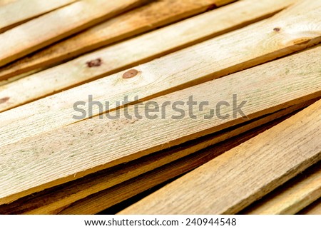 Building supplies, Stacked wood fence lumber