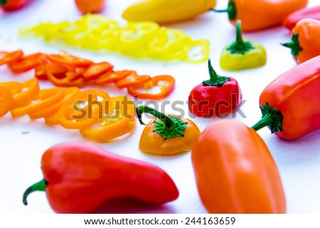 sliced red, yellow, orange hot peppers