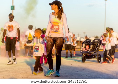 November 1, 2014 - Houston, TX, USA: Color Fun Fest 5K run. Runners completing the course with colored powder