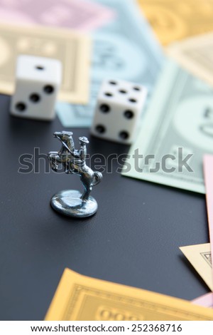 February 8, 2015 - Houston, TX, USA.  Monopoly horse, dice and money