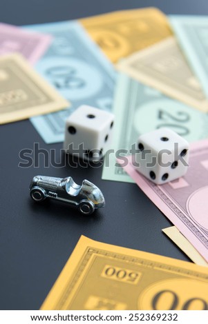 February 8, 2015 - Houston, TX, USA.  Monopoly car, dice and money