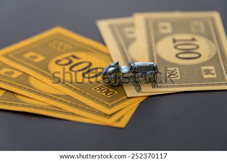 February 8, 2015 - Houston, TX, USA.  Monopoly car and money
