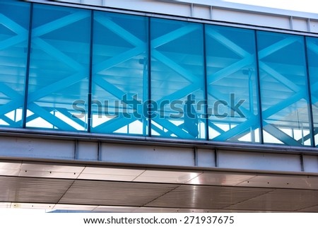 SFO, San Francisco International airport, USA - March 4, 2015: passenger walking in overhead bridge