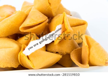 open fortune cookie with strip of white paper - YOU ARE GOING TO MAKE MISTAKES