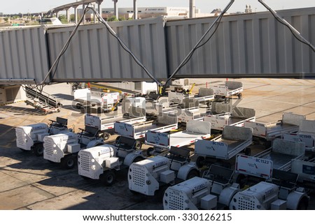 October 2, 2015, Phoenix, Arizona, USA - PHX airport. Luggage and carts on the ramp.