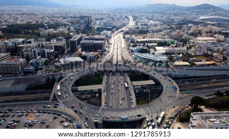 Aerial drone photo of multilevel junction ring road passing through dense populated city centre