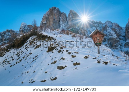Mountain cross of Gardena mountain pass of Dolomites mountain range o f Italy, Europe, Unesco World Heritage Site