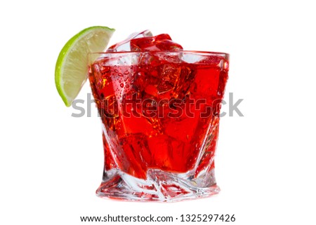 close up of a refreshing classic cocktail with vodka and cranberry juice served on the rocks with a lime wedge garnish isolated on a white background